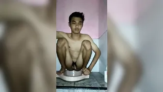 Cute indonesian boy squat shitting in toilet