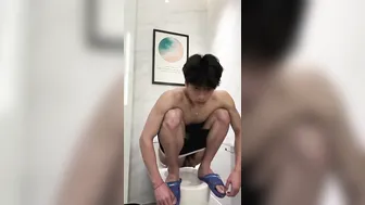 Handsome chinese guy pooping
