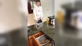 Twink pissing into a bottle