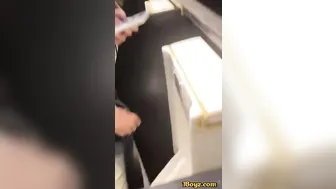 A male student is pissing in the toilet.