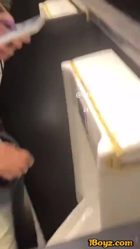 A male student is pissing in the toilet.