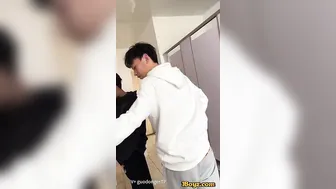 A male student is pissing in the toilet. 2