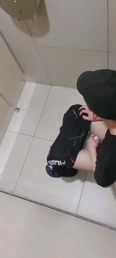 Twink wearing black clothes is voyeurized wiping his ass after taking a shit