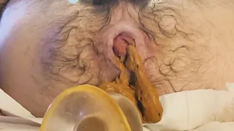 Hairy ass pushes out buttplug to shit