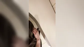 A male is pissing in the toilet. 4