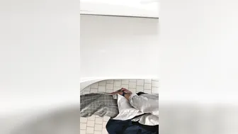 A male is pissing in the toilet. 5