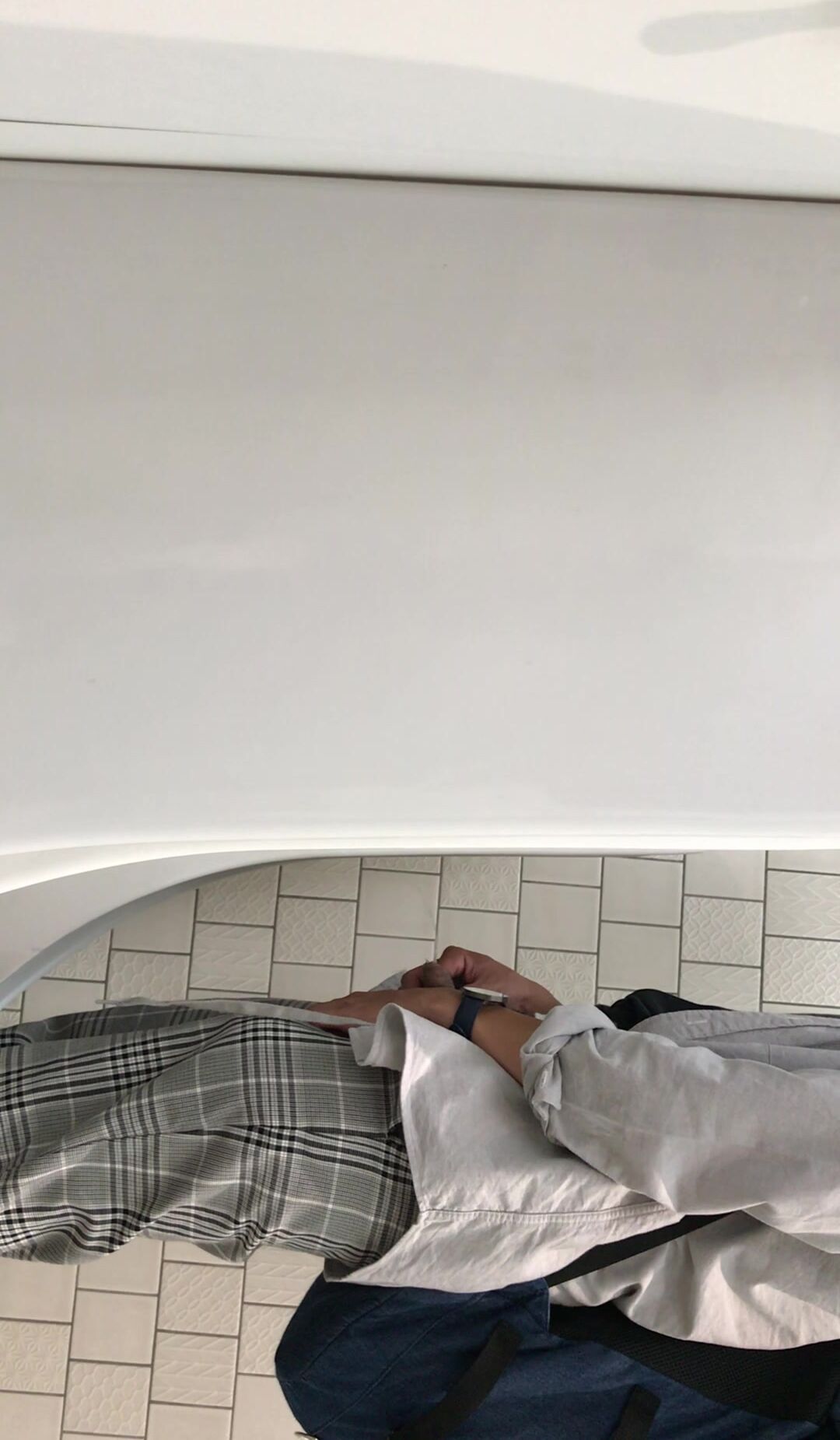 A male is pissing in the toilet. 5