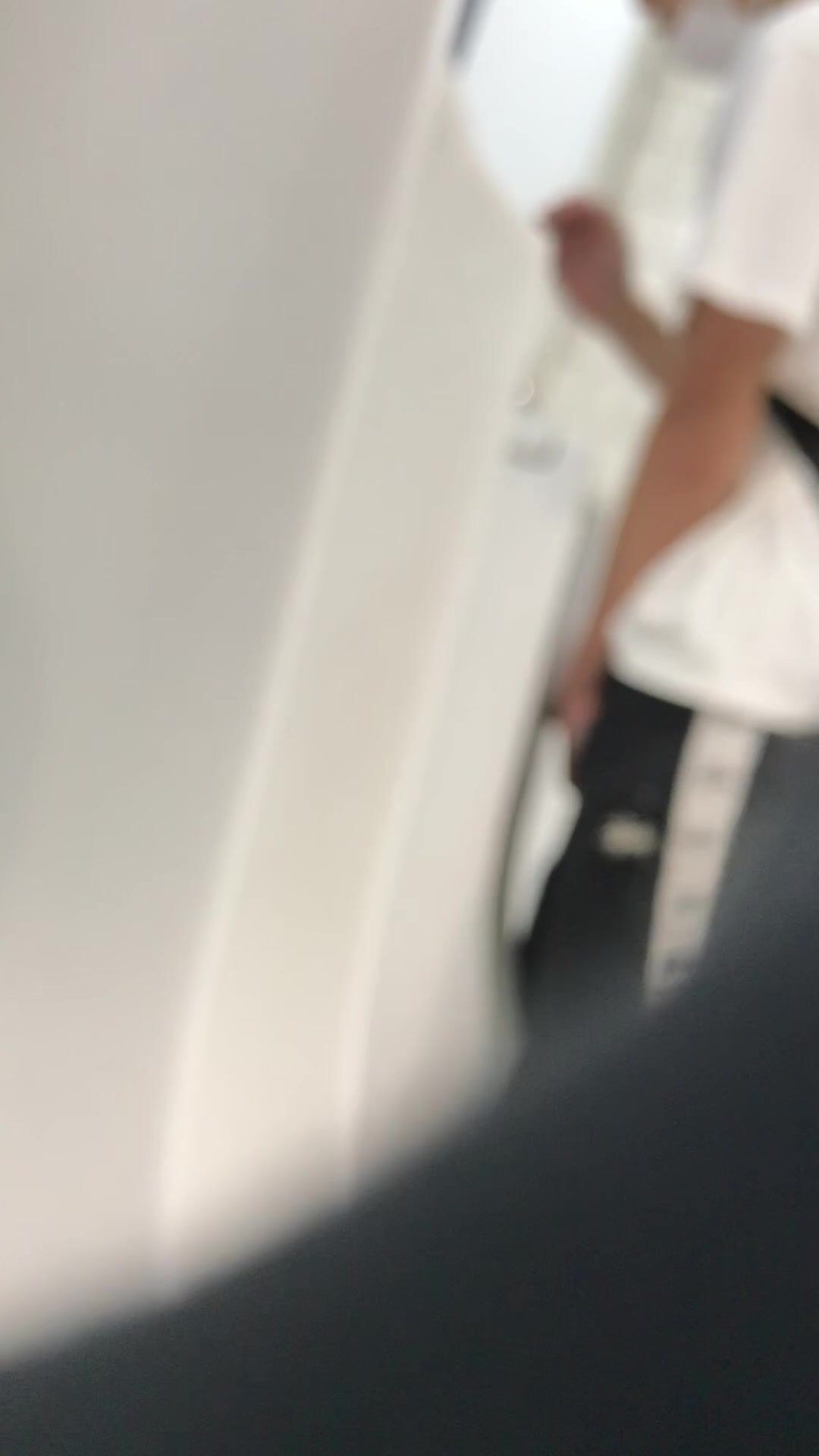 A male is pissing in the toilet. 7