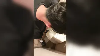 A male is pissing in the toilet. 8