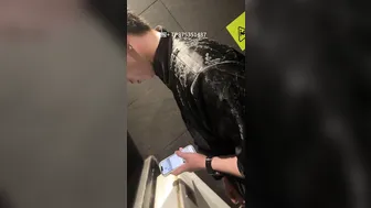 A male is pissing in the toilet. 9