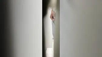 A male is pissing in the toilet. 10
