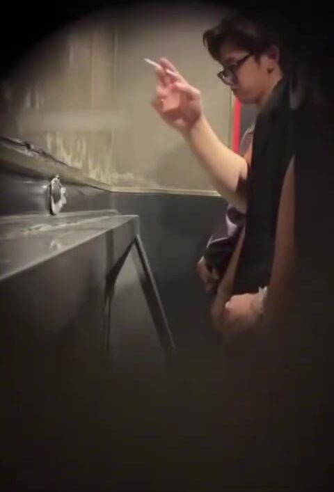 Males  are pissing in the toilet. 2