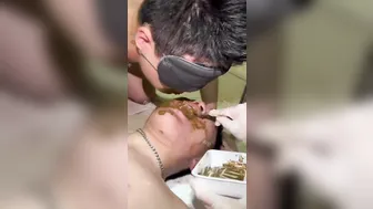 A pair of Asian Pigs eat shit