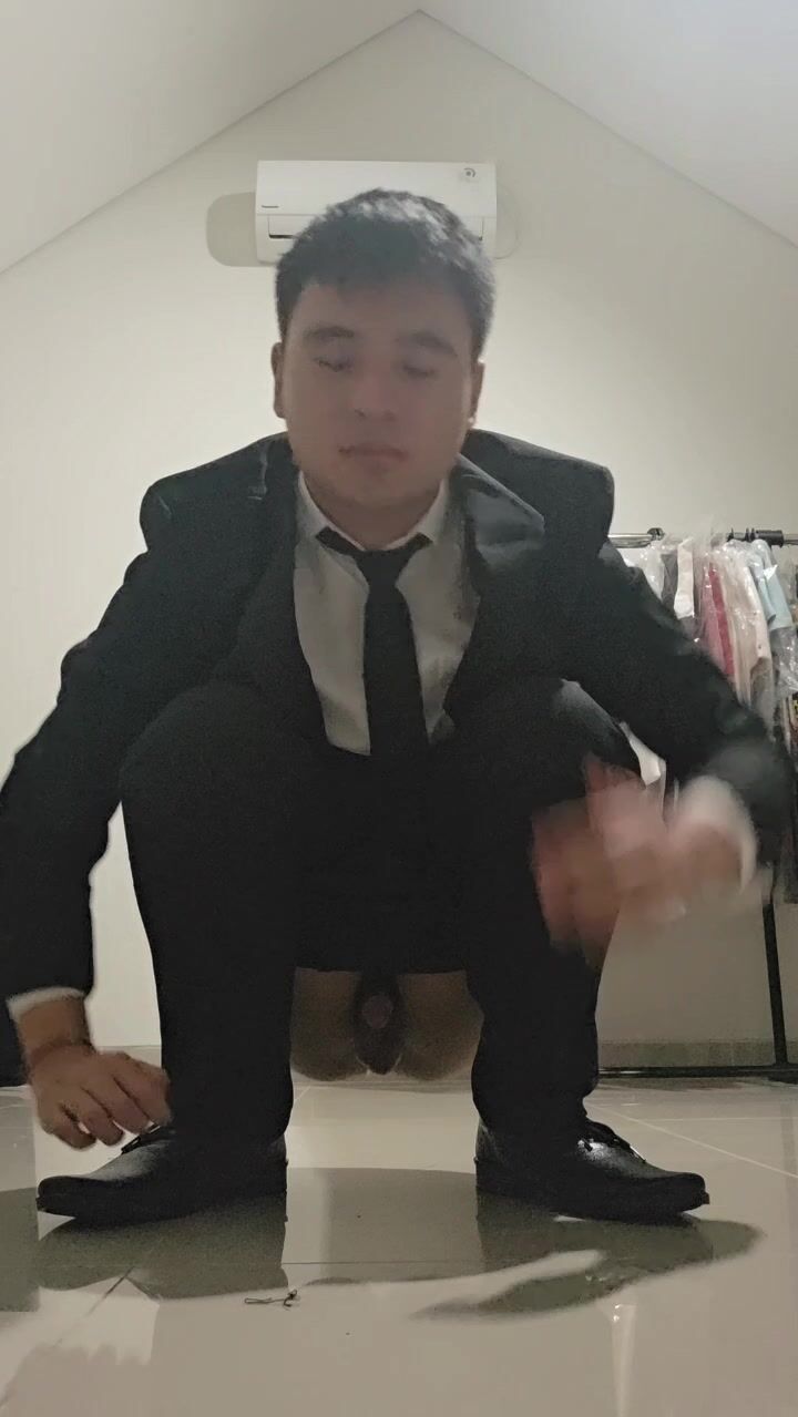 Business guy shitting (face)