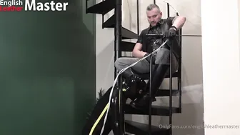 Leather daddy uses rubber gimp