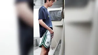 A male is pissing in the toilet. 20