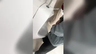 Male students are pissing in the toilet.