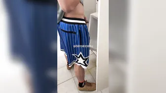 A male student is pissing in the toilet. 9