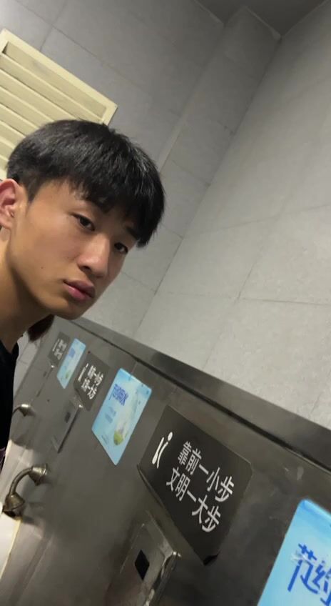 A male is pissing in the toilet. 22
