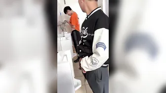 Males are pissing in the toilet. 3