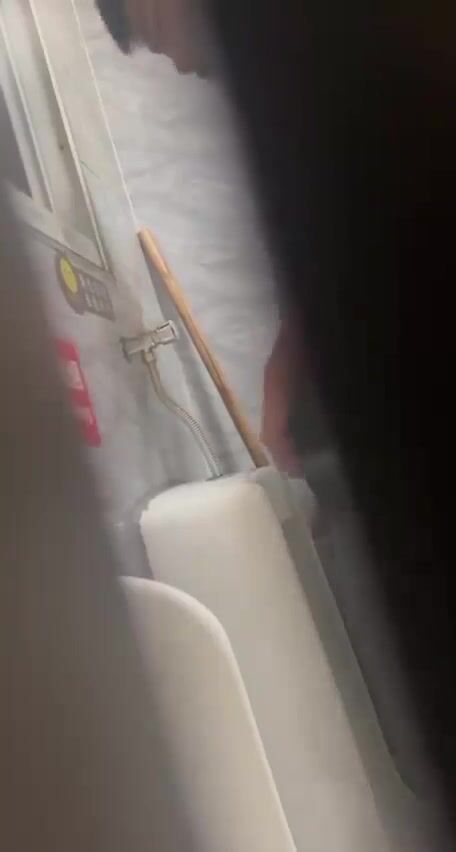 A male is pissing in the toilet. 25