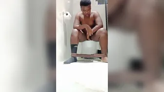 chubby Ebony boy fills toilet